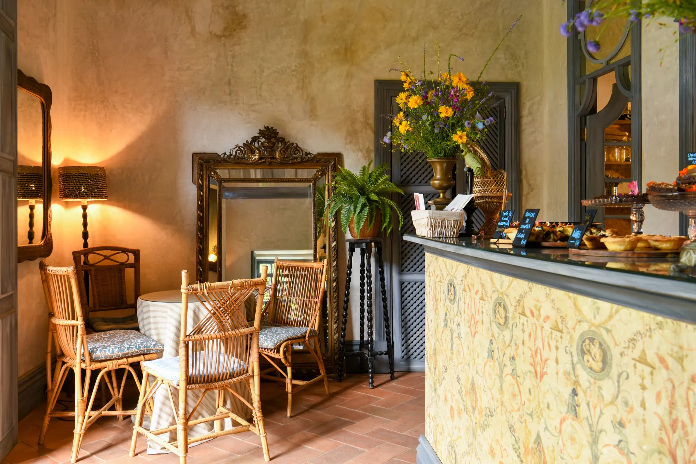 The café's hand-patterned counter and rattan chairs