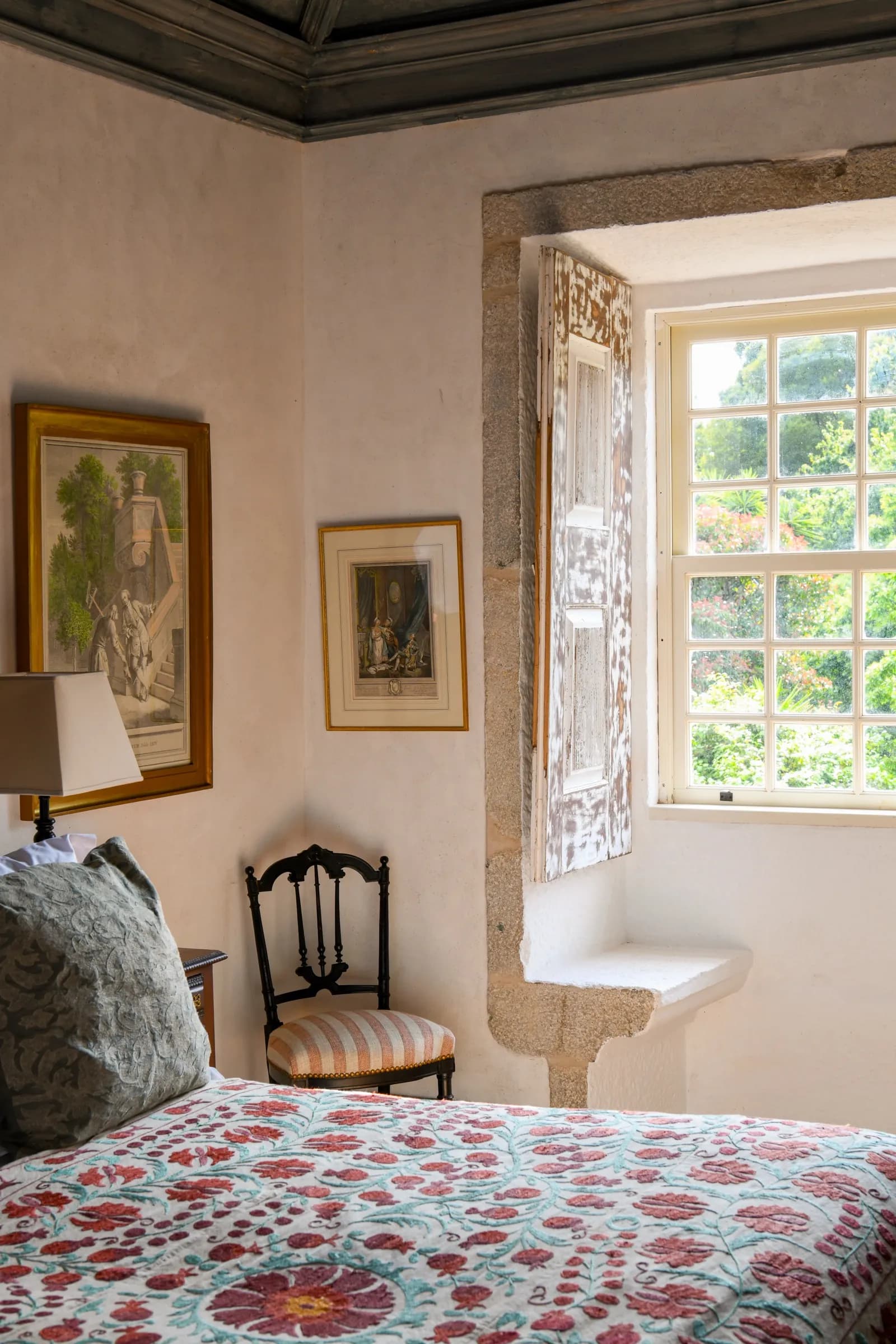 The Camelia suite — a garden-view room under timber beams