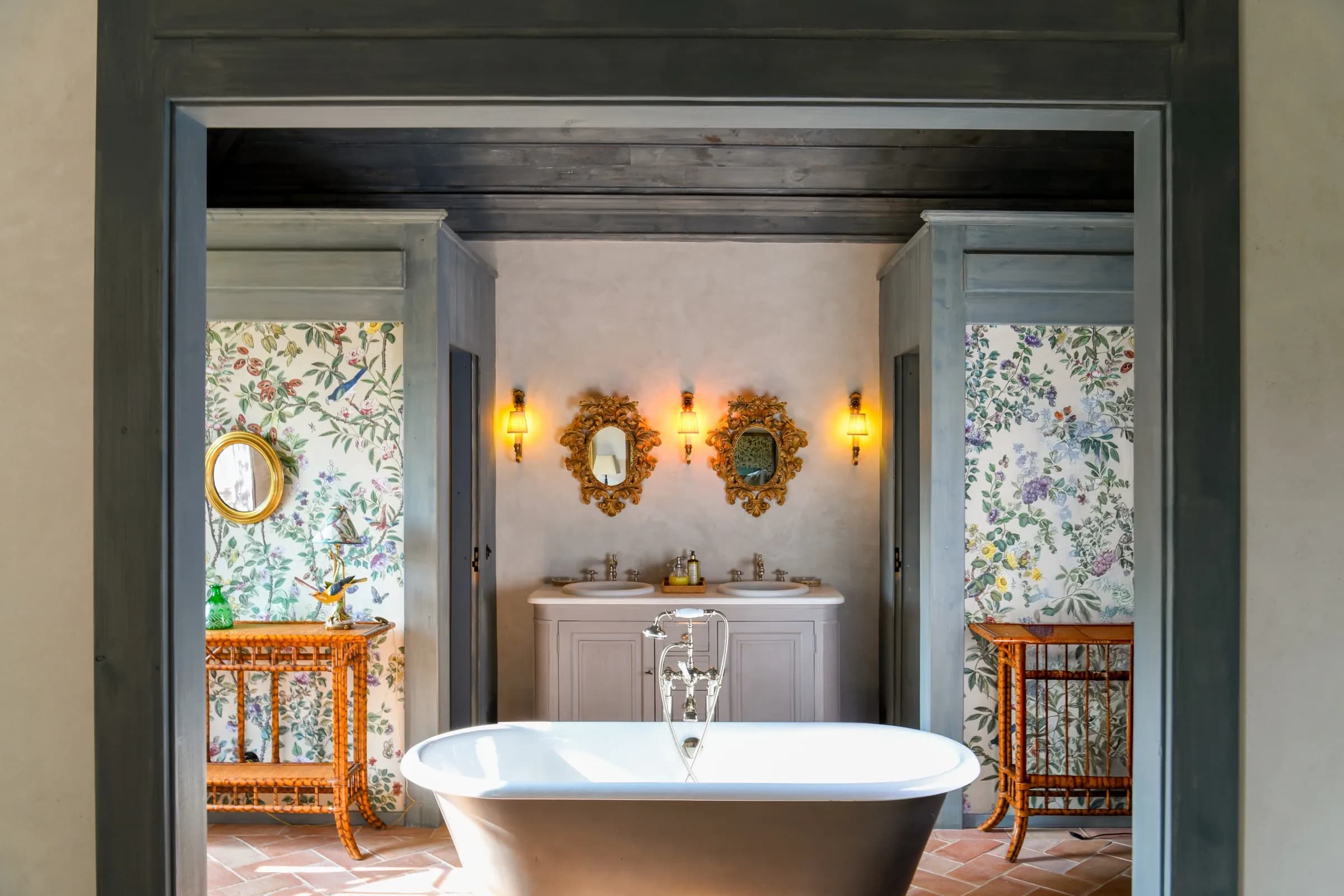 The Capucine cottage suite — a freestanding bath between the rooms