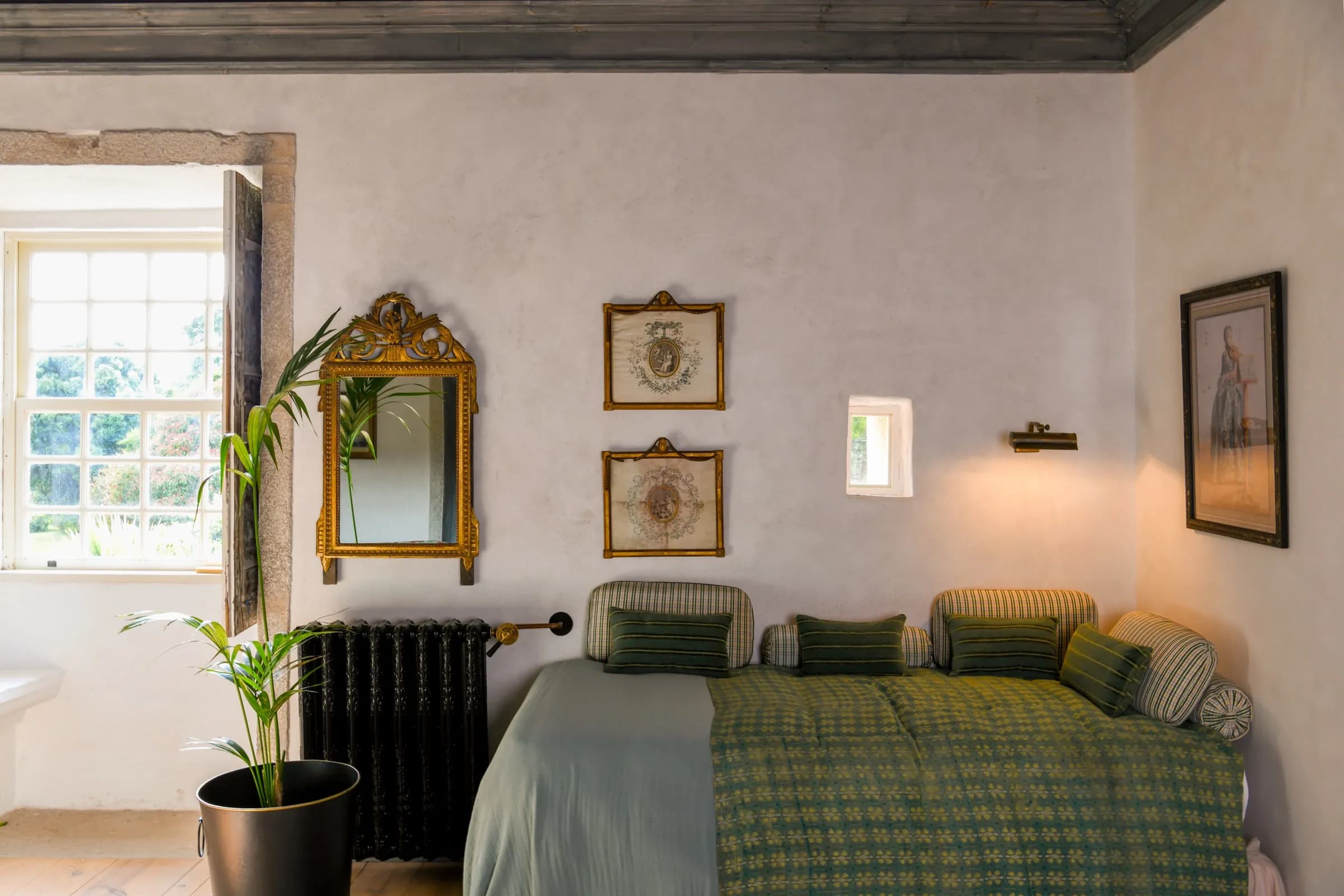 The Lilas suite — quiet green tones with a river-and-park view