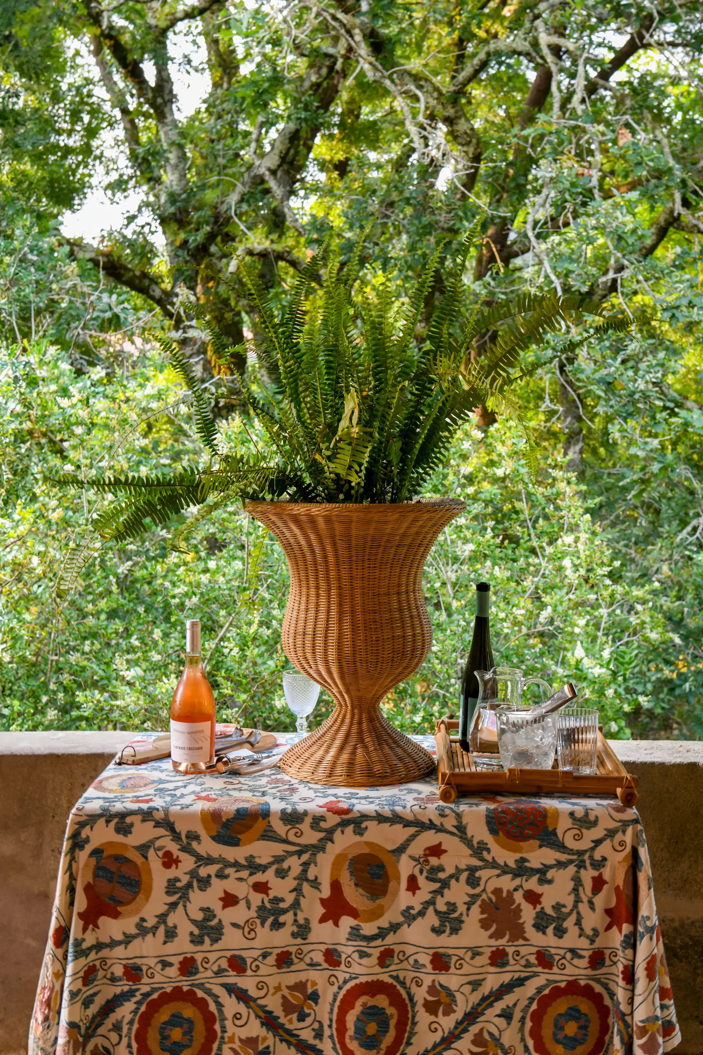 A private dinner set on the terrace, wine and wildflowers
